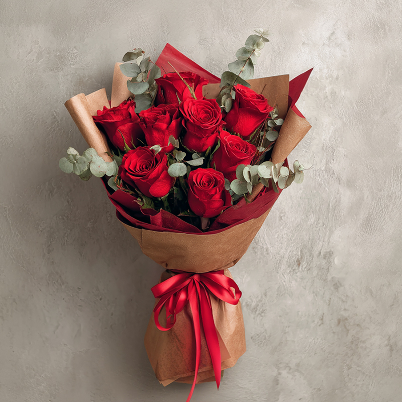 How should the Dayton couple sign the flower basket presented as a gift for the grand opening of the